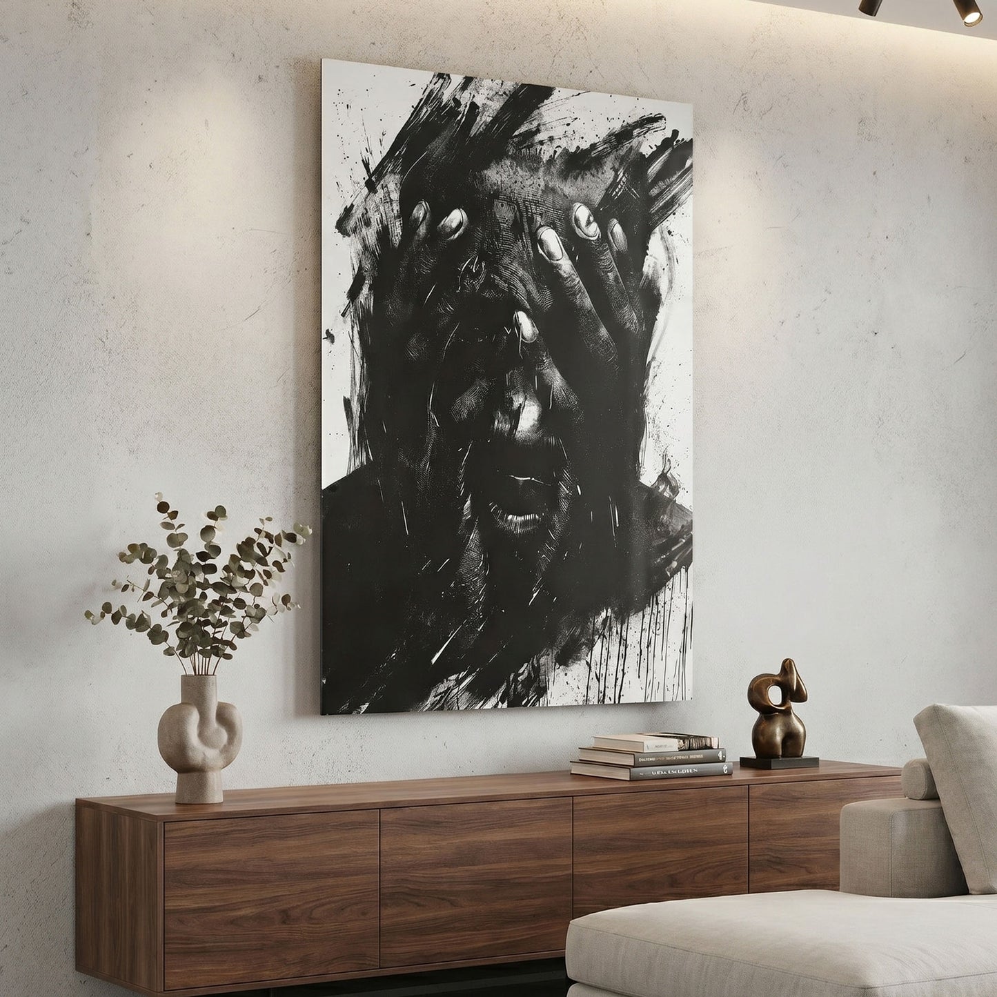 Modern living room with abstract black and white metal print on the wall, wooden sideboard, and decorative items.