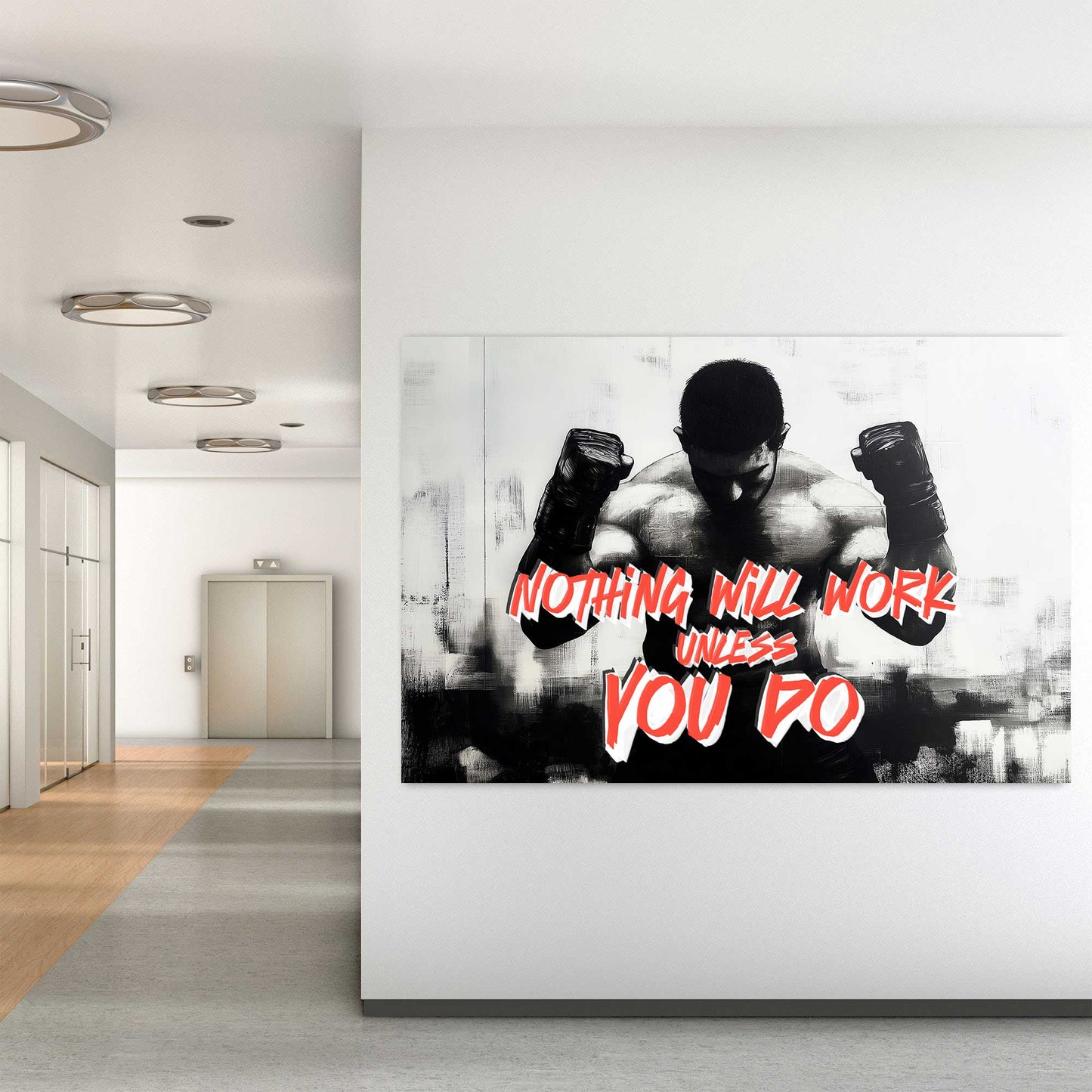 A black-and-white wall art print of a muscular boxer with clenched fists, accompanied by the motivational text "Nothing Will Work Unless You Do."