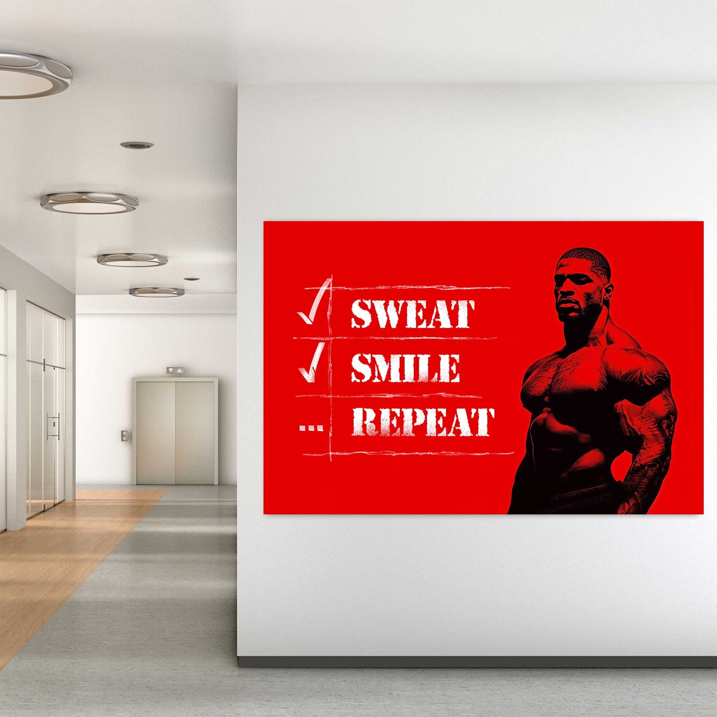 A metal print of a muscular figure on a bright red background with the text "Sweat Smile Repeat" in bold black-and-white typography.