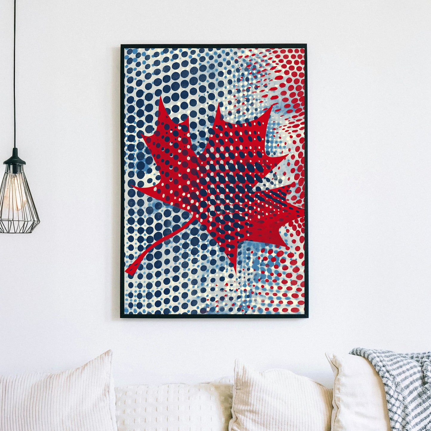 Pop art-style maple leaf artwork with bold red, blue, and white halftone dots in a modern Canadian design.