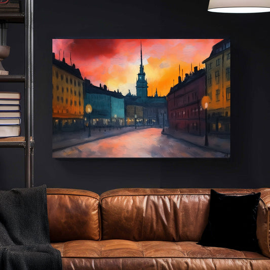Impressionist wall art of a European city at sunset with glowing streetlights and a warm, textured sky.