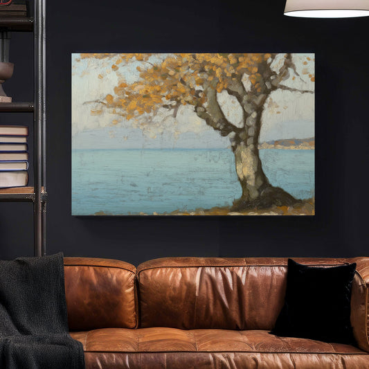 Oil wall art of a golden autumn tree by a peaceful blue shoreline, with textured brushstrokes creating depth and warmth.