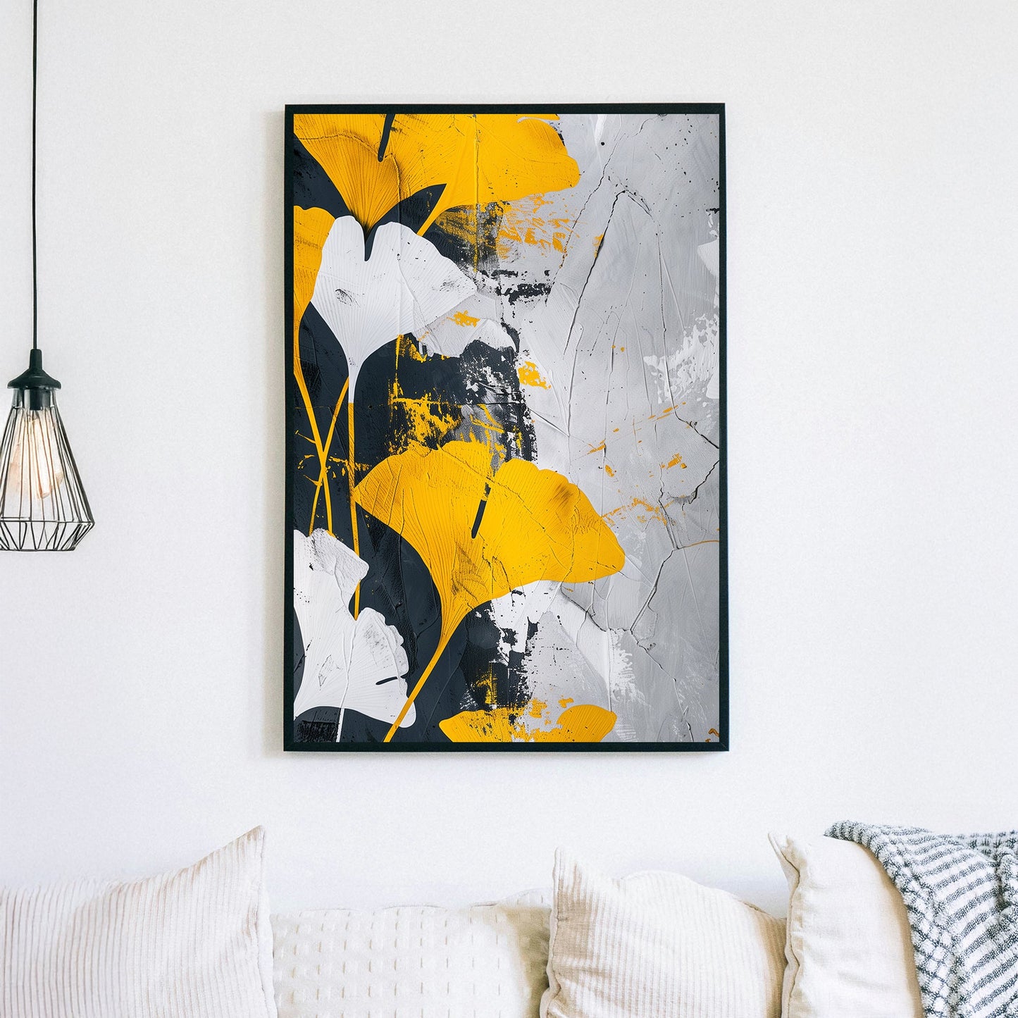 Abstract wall art of golden-yellow ginkgo leaves against a black, white, and grey textured background.