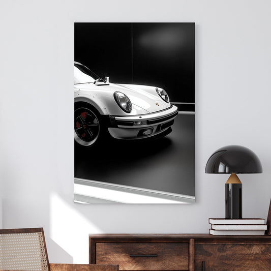 Close-up of a white Porsche 911 against a black background, showcasing its sleek design and iconic headlights.