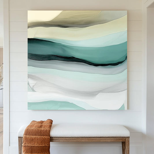 Abstract layered wall art in soft teal, sage, beige, and white, resembling ocean waves and sandy shores.