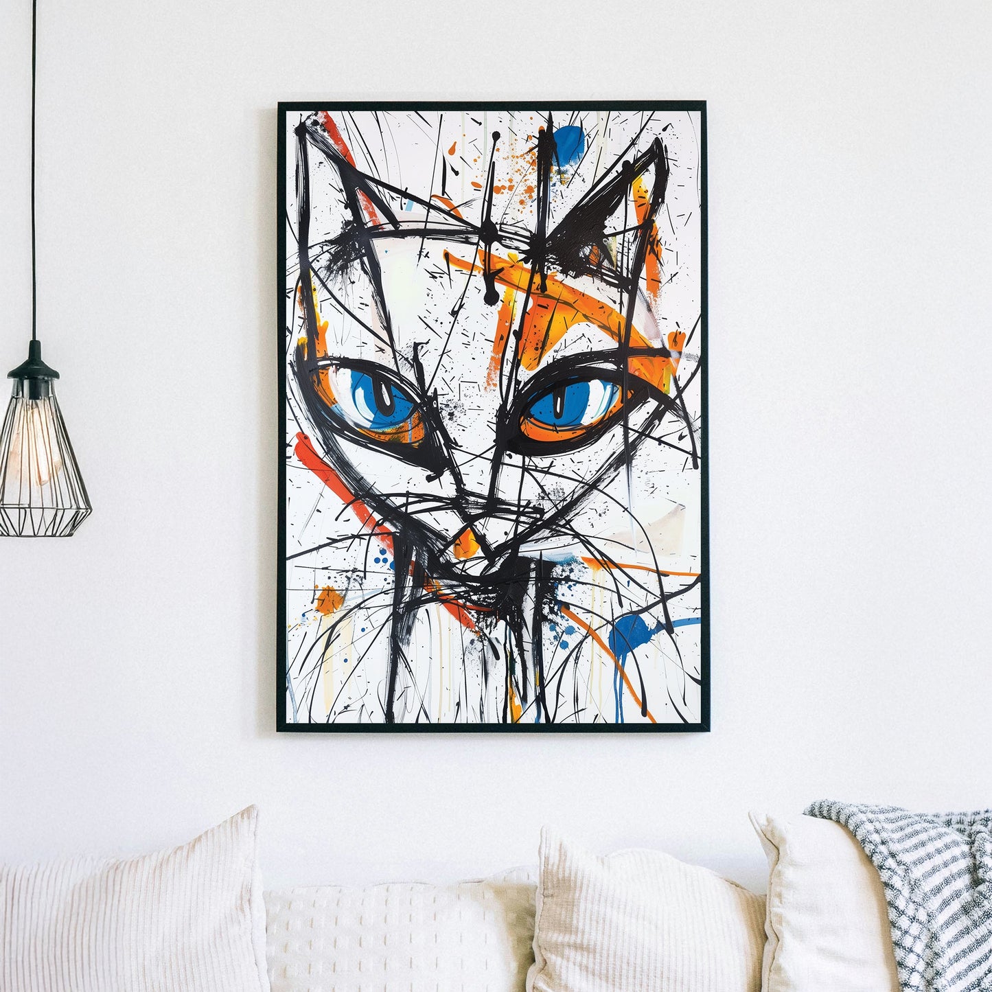 Wall art featuring abstract cat face with blue eyes and expressive paint splashes