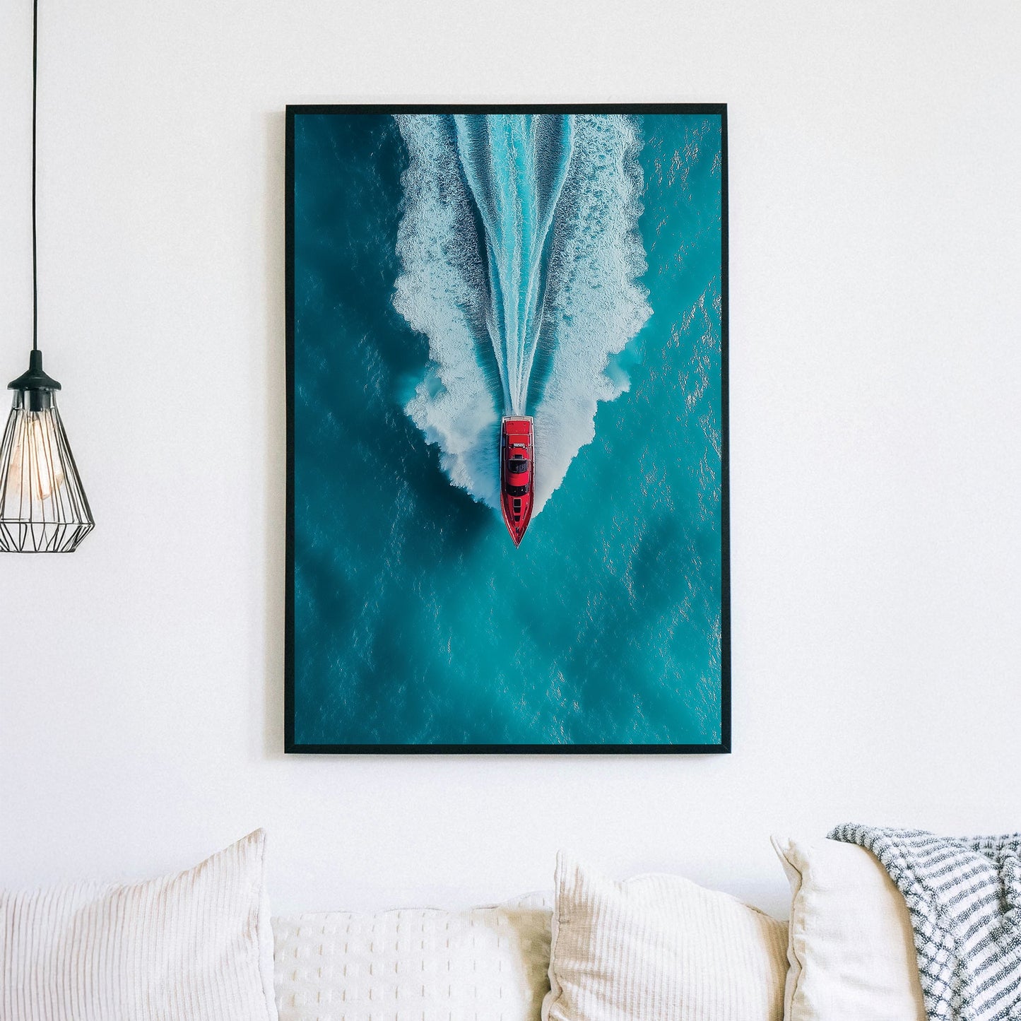 Aerial wall art of red boat speeding across turquoise ocean