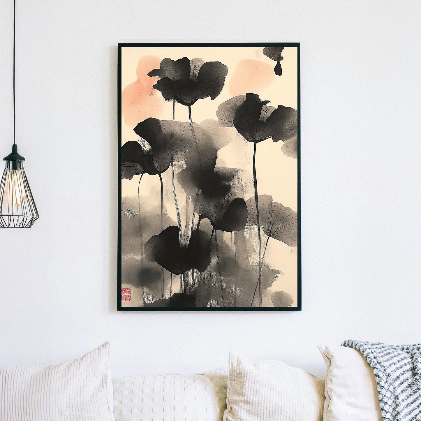 Wall art of abstract black lotus flowers in Japanese ink style with soft coral accents