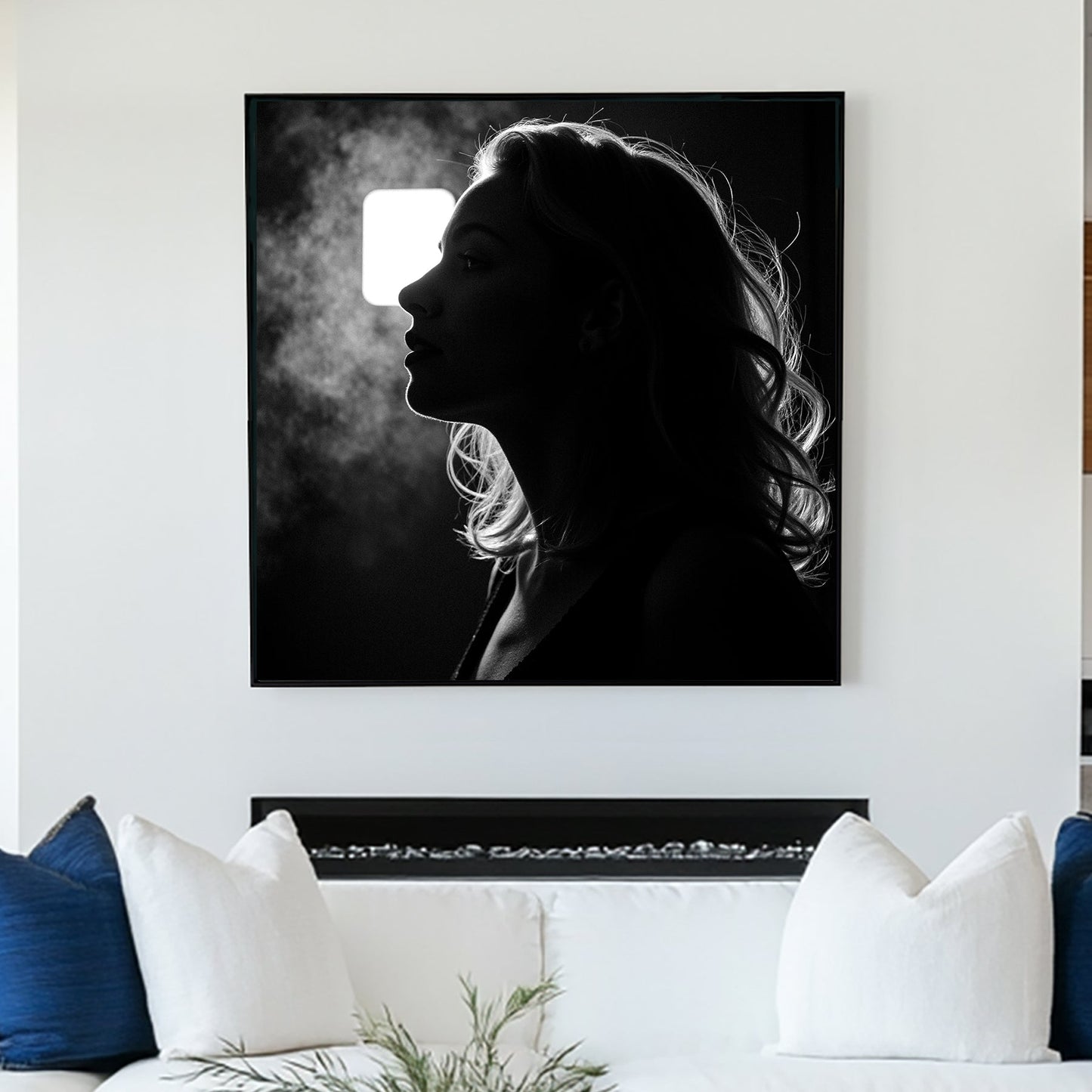 moody black and white wall art of woman exhaling in silhouette with backlight