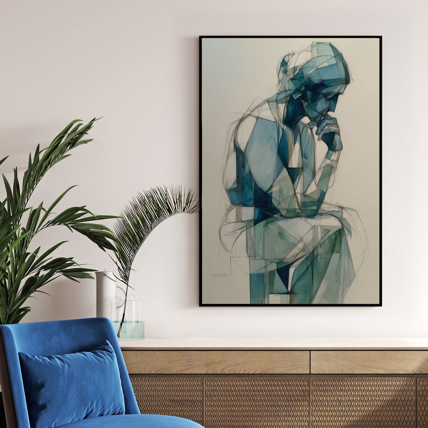 blue geometric figure wall art of person in deep thought