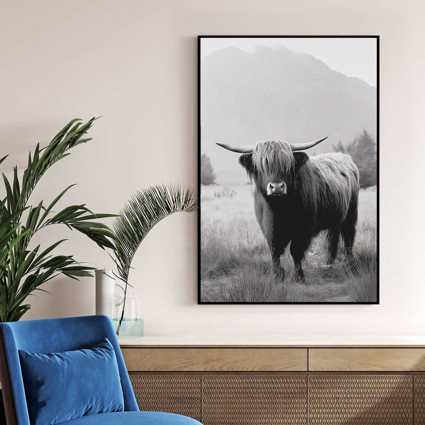 black and white highland cow photograph in front of misty mountain