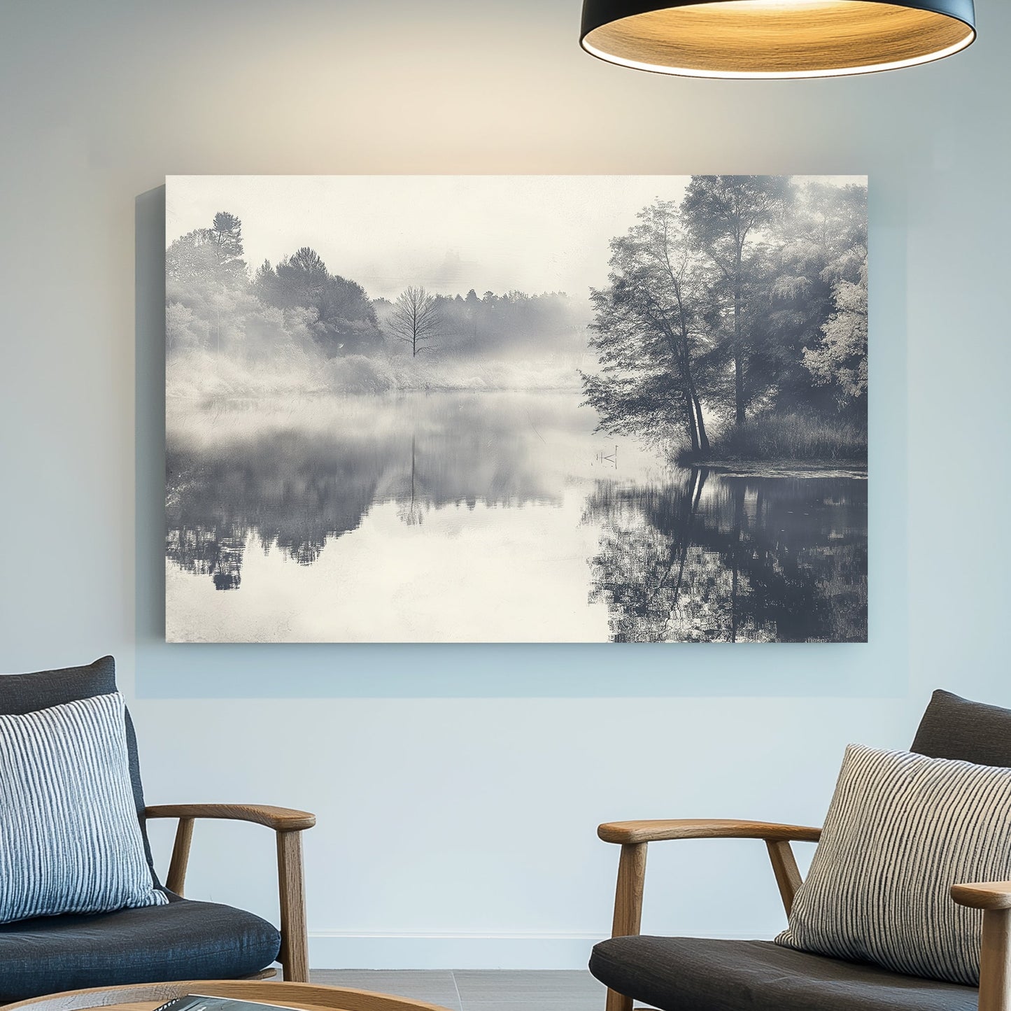 black and white landscape of foggy lake with trees reflected in still water