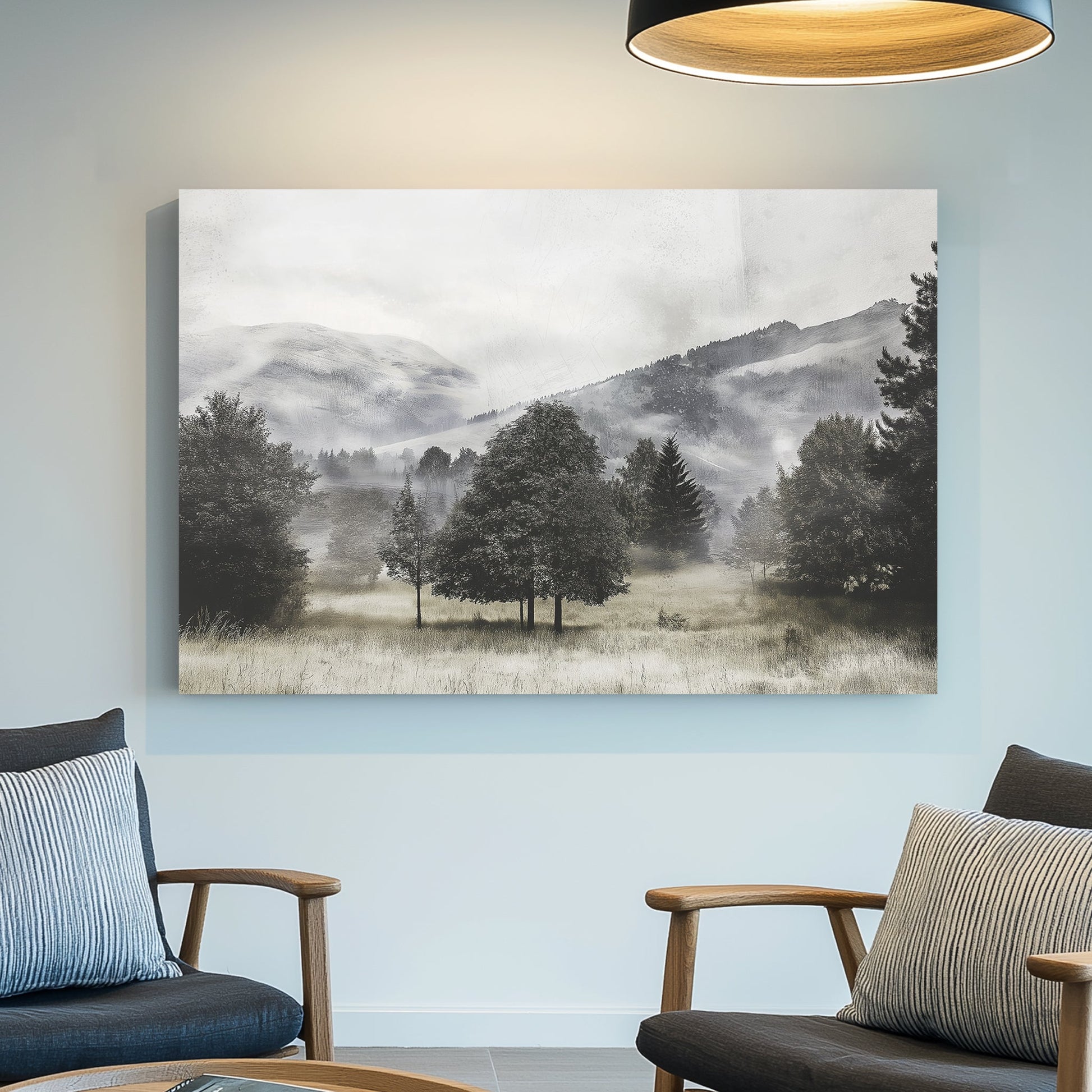 black and white landscape of foggy trees and distant hills in open meadow