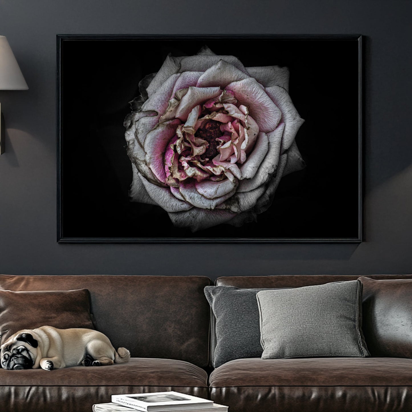Faded close-up of a dusty pink rose with aged petals on a black background