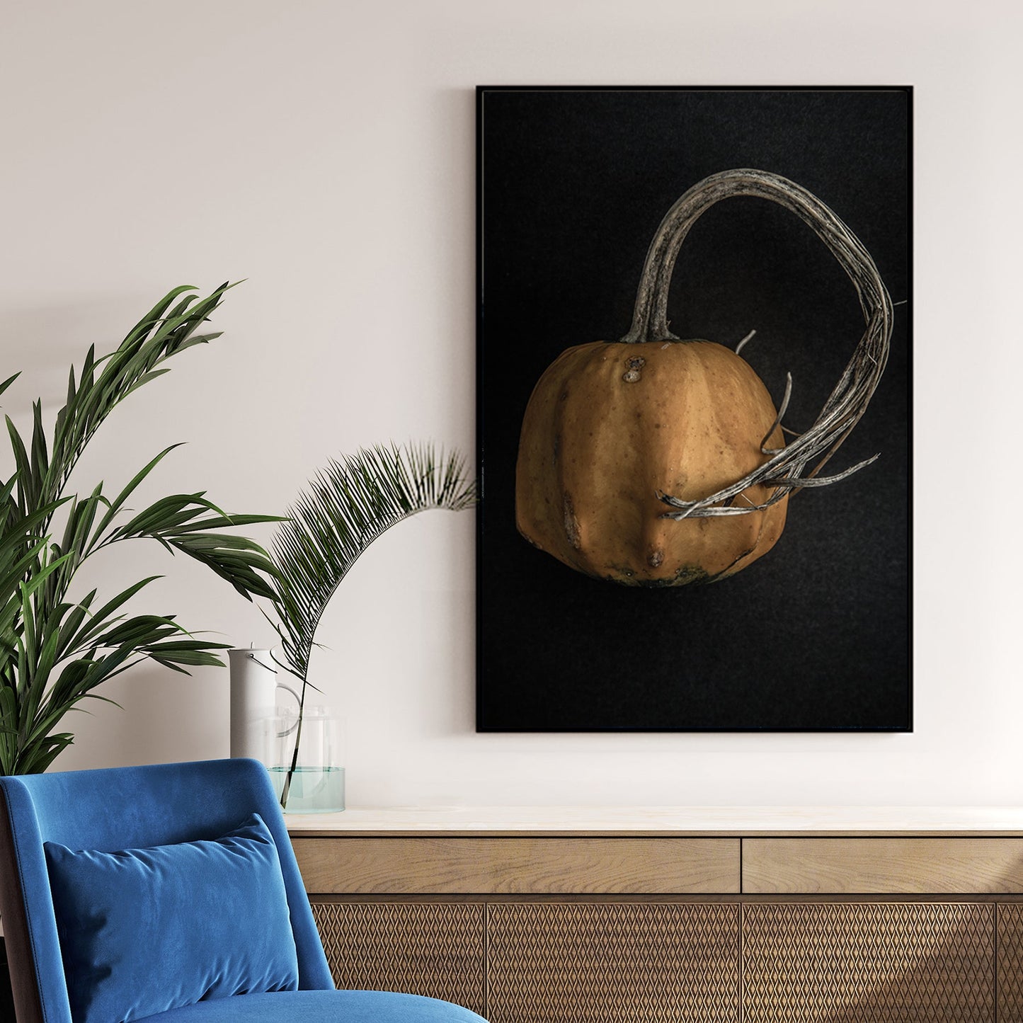 close-up of orange gourd with twisted stem on black background