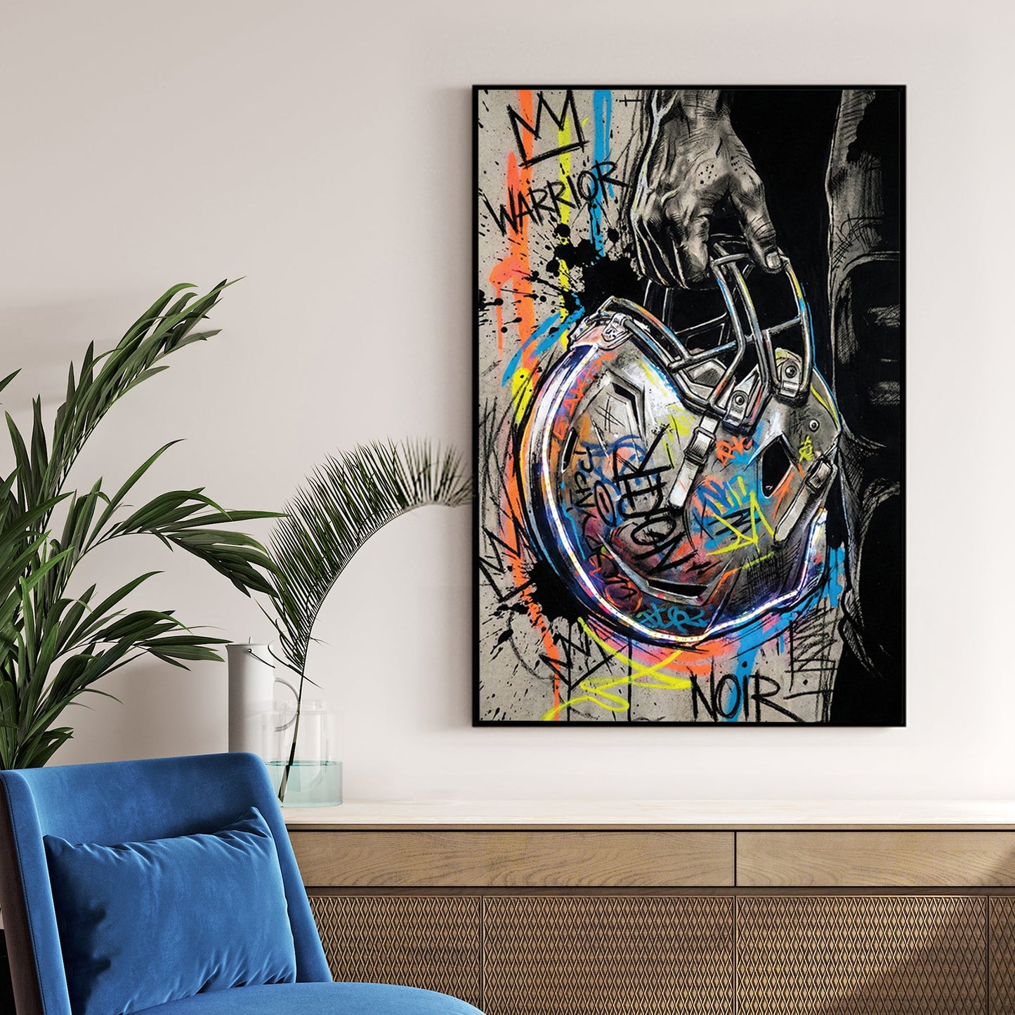Football helmet wall art featuring a hand-held helmet with graffiti and street art details.