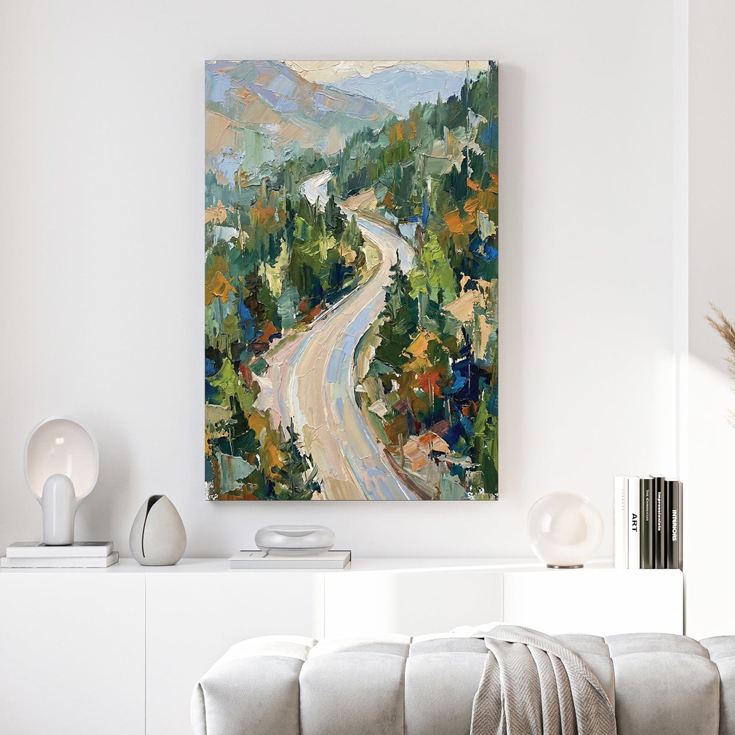 Impressionist wall art of a winding mountain road through a green forest.