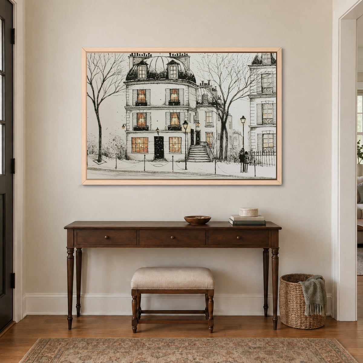 Paris Townhouse Snow framed canvas in a natural wood floating frame above a dark wood console table and upholstered bench