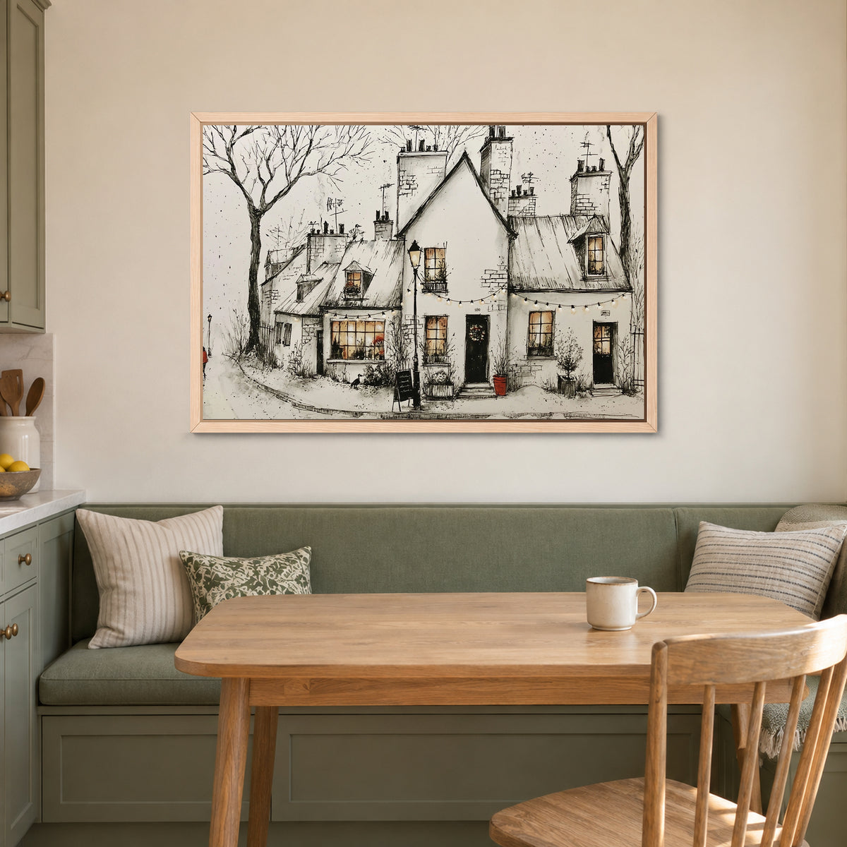 Paris Corner Cafe Snow framed canvas in a natural wood floating frame above a green banquette and wooden table in a breakfast nook