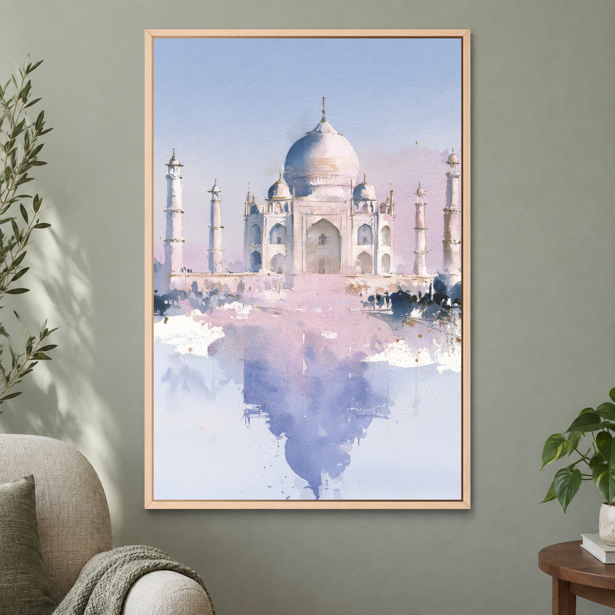 Taj Mahal Soft Watercolour framed canvas in a natural wood floating frame on a sage green wall beside a cream armchair