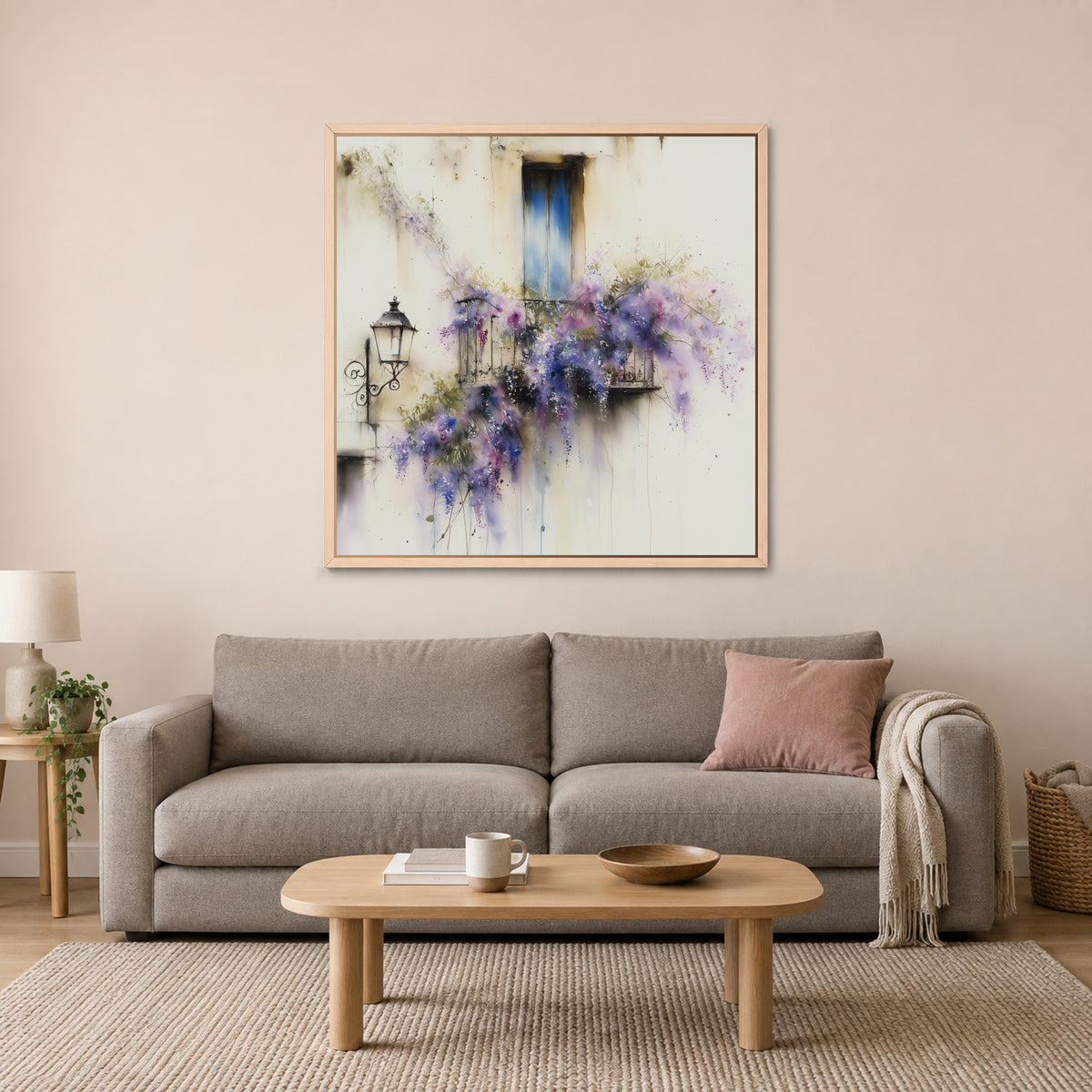 Wisteria in Full Bloom framed canvas in a natural wood floating frame above a taupe sofa with a pink cushion and an oval wooden coffee table