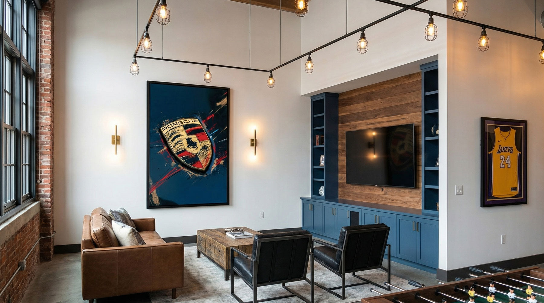 Man cave decor — Porsche Crest canvas print as the statement wall piece in a bright industrial loft with exposed brick and cage pendant lighting