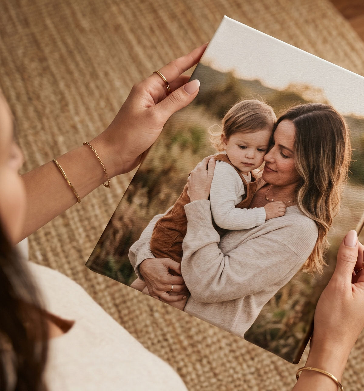Woman holding a custom canvas photo print of a mother and child personalized photo gifts for Mother's Day