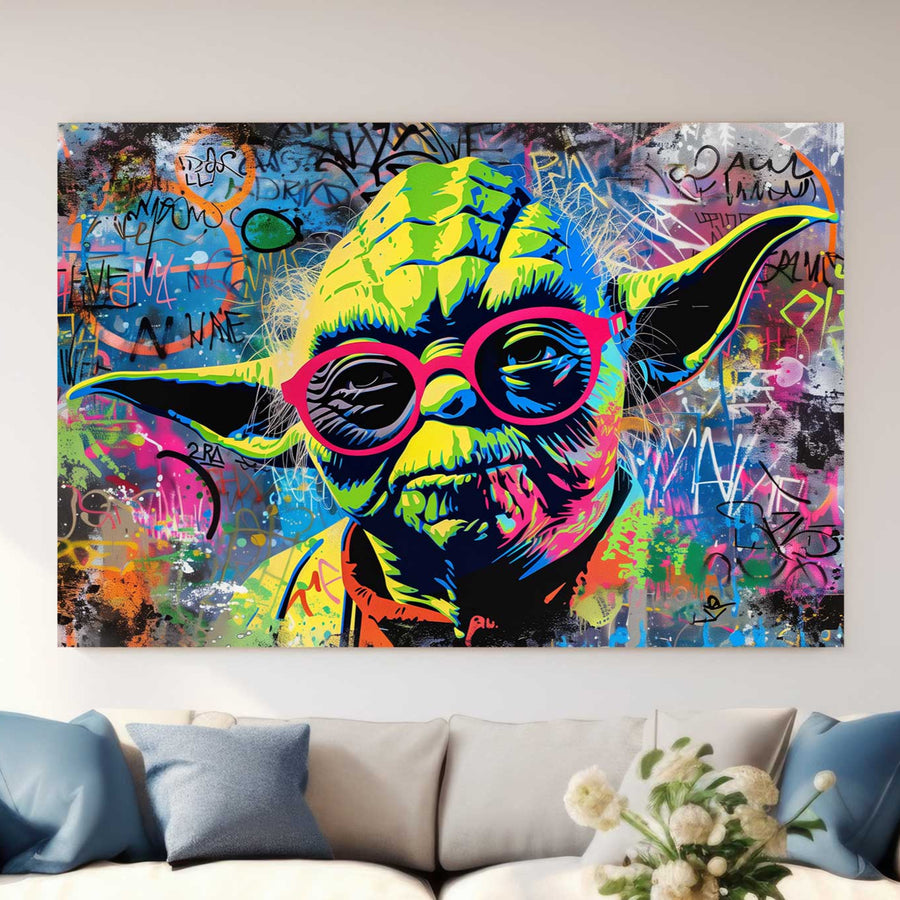 Graffiti-style neon artwork of Master Yoda from Star Wars wearing glasses, set against a chaotic, colourful background inspired by Basquiat’s bold strokes.