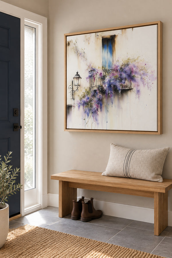 Oak-framed wisteria artwork above a bench beside a navy front door.