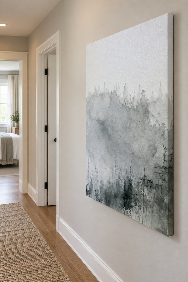 Unframed misty forest canvas along a quiet hallway with oak flooring.