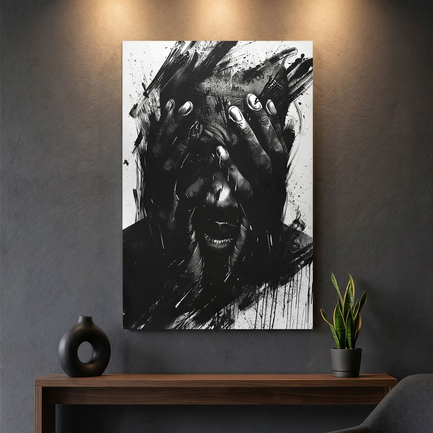Abstract black and white canvas print on a wall above a wooden console table with decorative items.