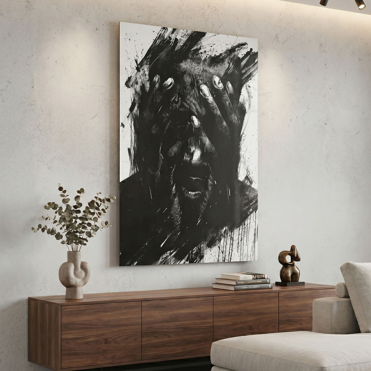 Modern living room with abstract black and white metal print on the wall, wooden sideboard, and decorative items.