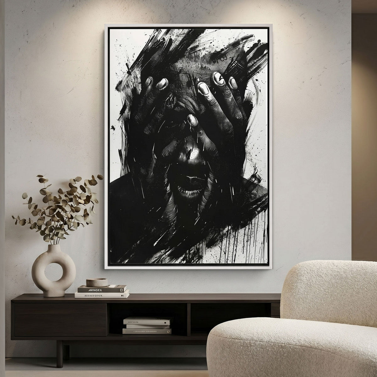 Abstract black and white canvas print on a wall above a wooden cabinet with decorative items.