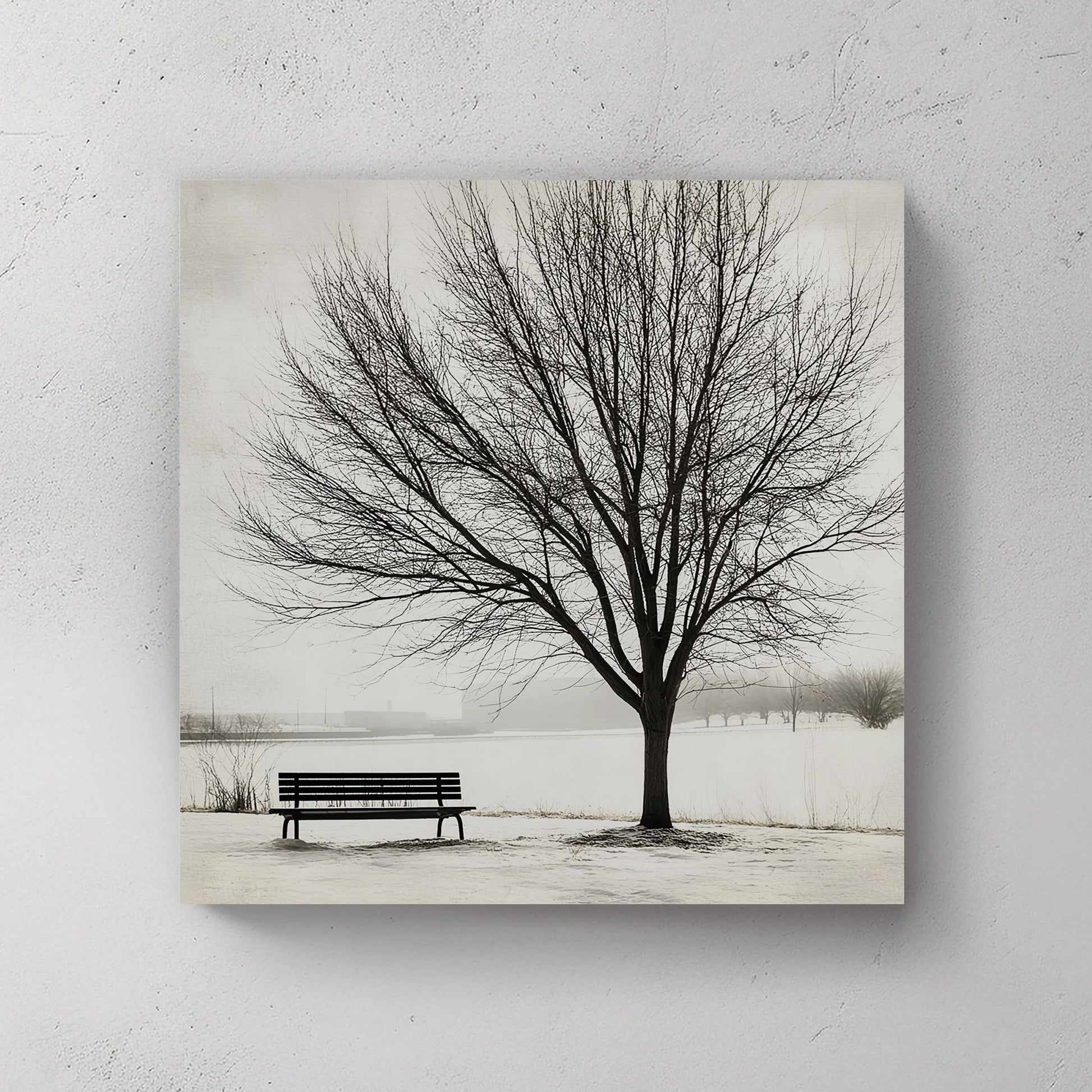 Lone tree with a bench in a snowy landscape, minimalist winter artwork.