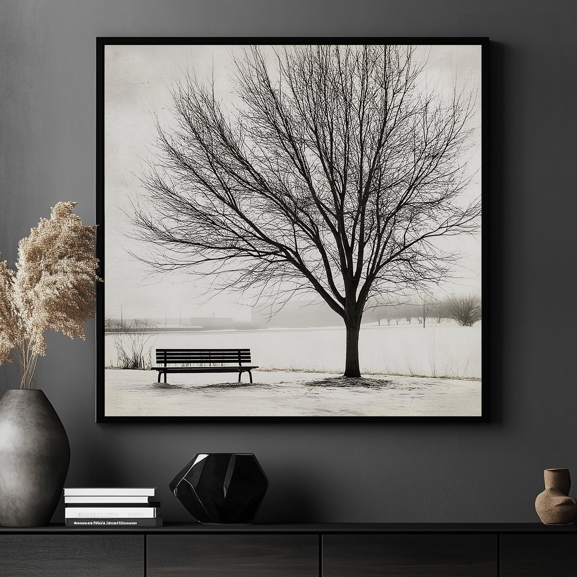 Lone tree with a bench in a snowy landscape, minimalist winter artwork.