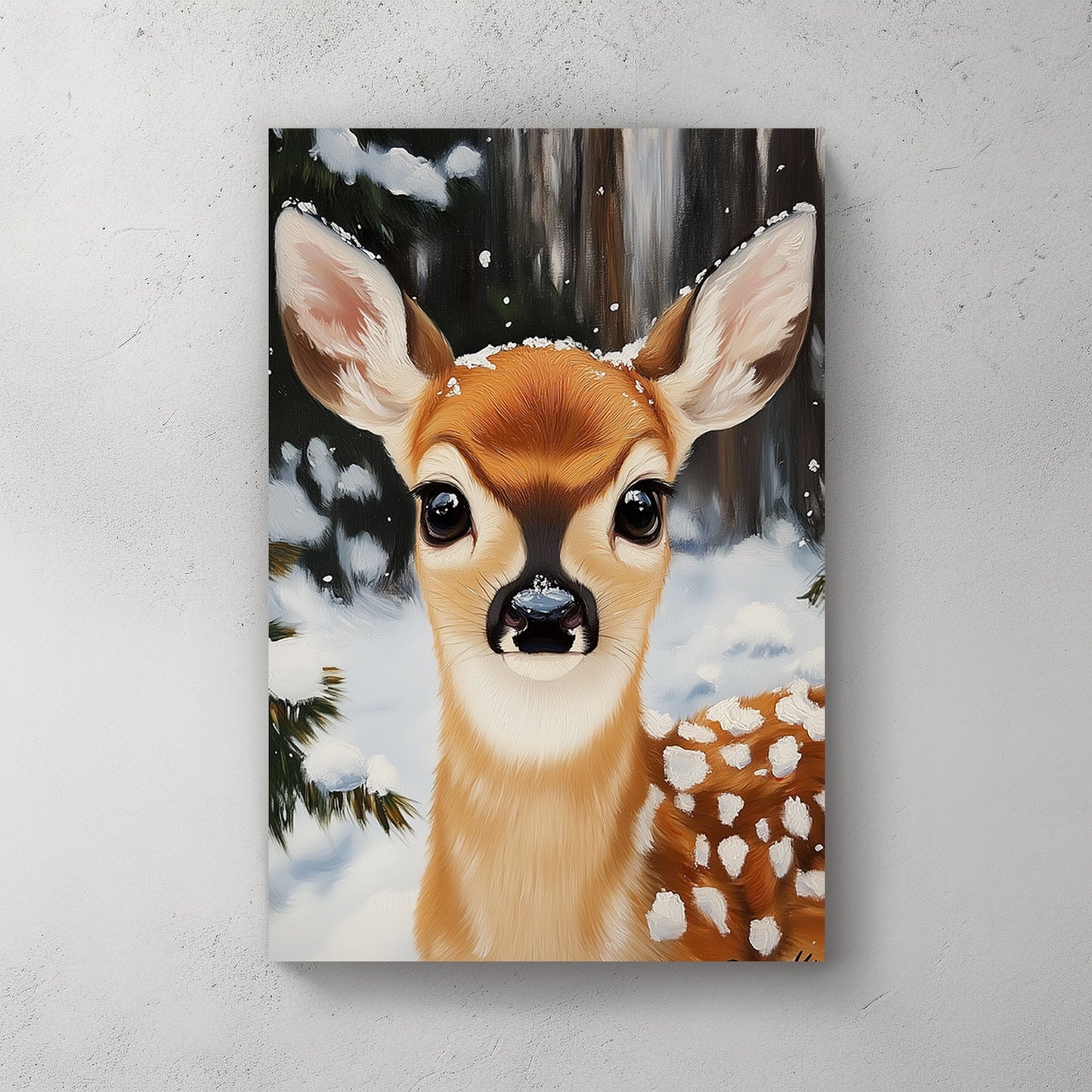 Close-up of a fawn with snowflakes on its fur, set in a snowy forest backdrop, creating a serene winter scene.