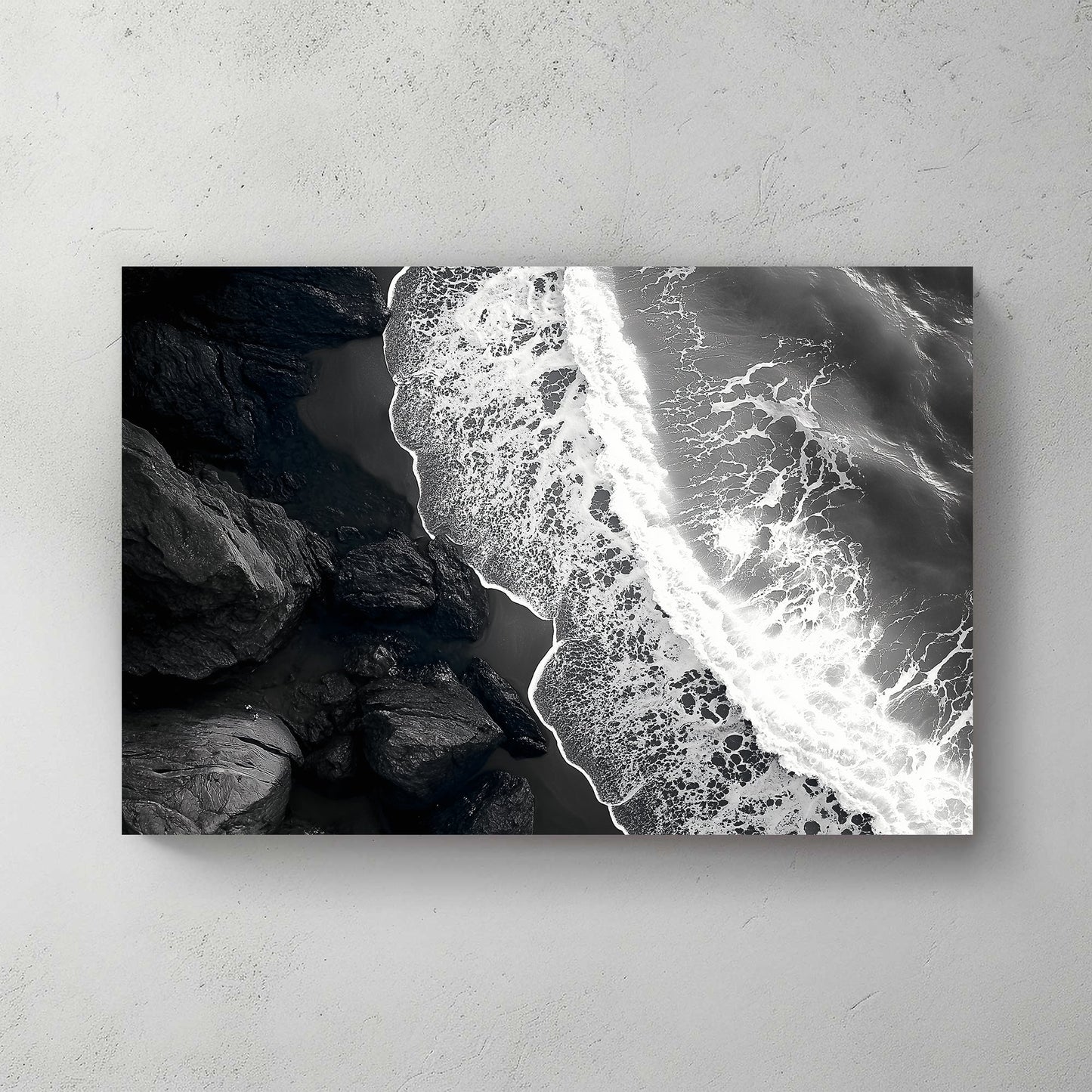 This striking black-and-white photograph captures the powerful contrast between rugged rocks and the ocean. Perfect for modern decor. canvas wall art abstract portrait landscape