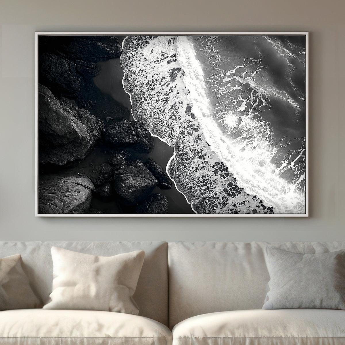 This striking black-and-white photograph captures the powerful contrast between rugged rocks and the ocean. Perfect for modern decor. canvas wall art abstract portrait landscape