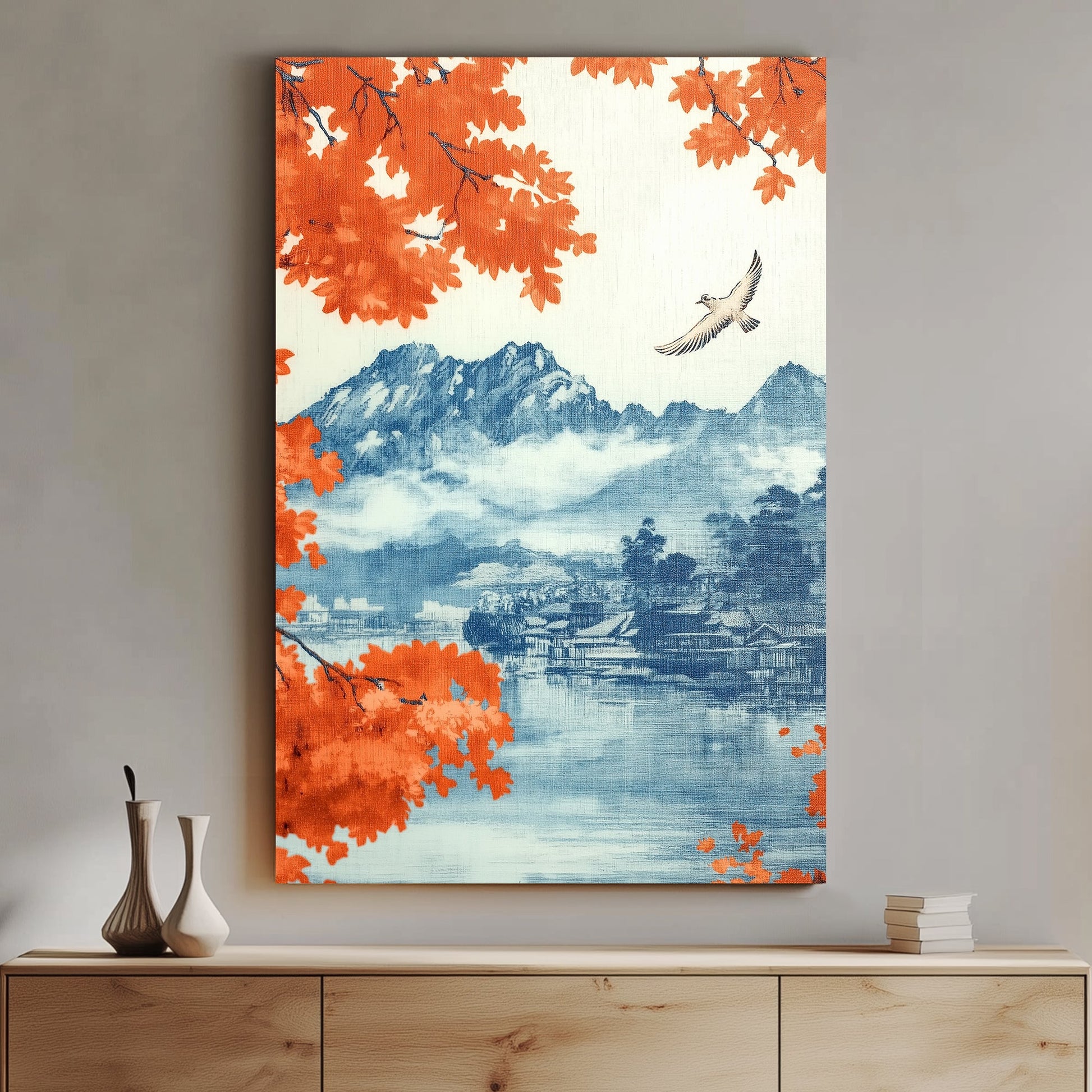 A serene mountain landscape framed by vibrant autumn leaves and a lone bird soaring over still water. Perfect for modern decor. canvas wall art abstract portrait