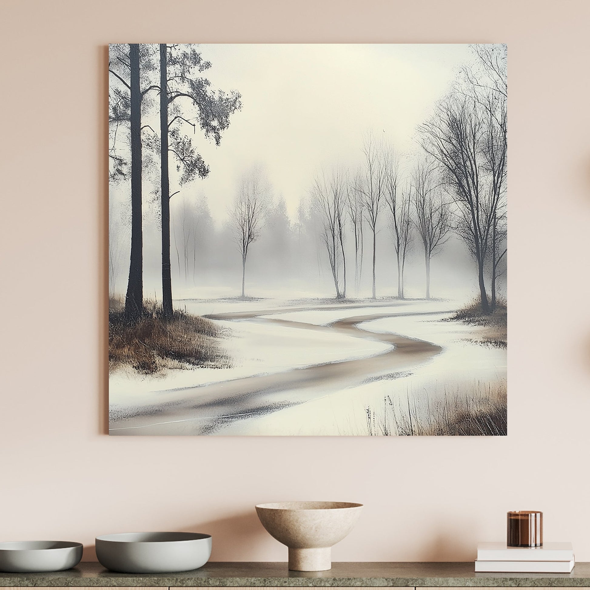 Misty winter landscape with a winding frozen path and bare trees.