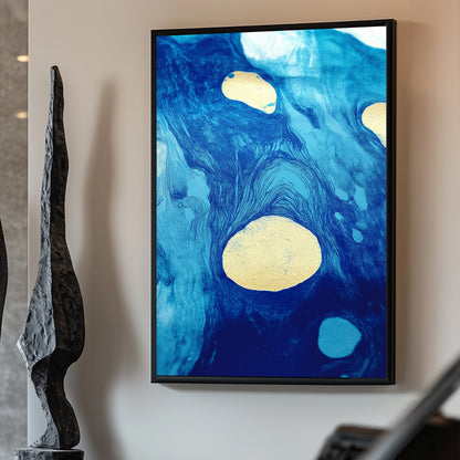 Abstract artwork featuring swirling blue tones with gold accents, resembling flowing water and celestial patterns.