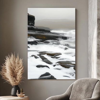 Impressionist artwork of waves flowing over rugged coastal cliffs under a misty, overcast sky.