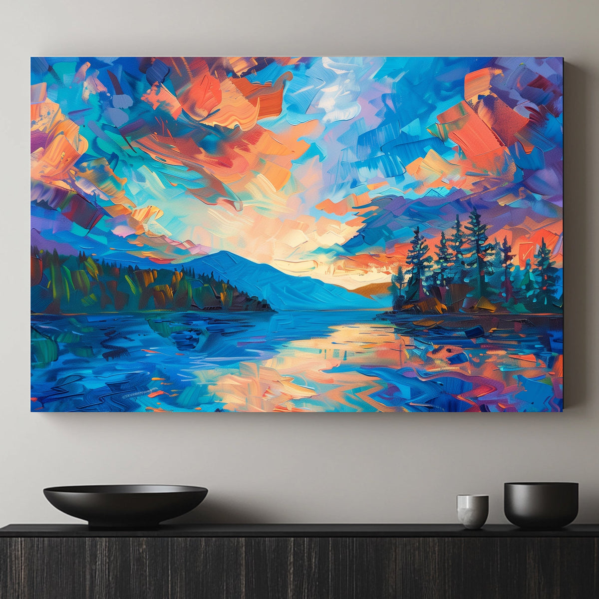 Landscape of a vivid sunset with bold blues, oranges, and purples reflected on serene waters and framed by silhouetted trees.