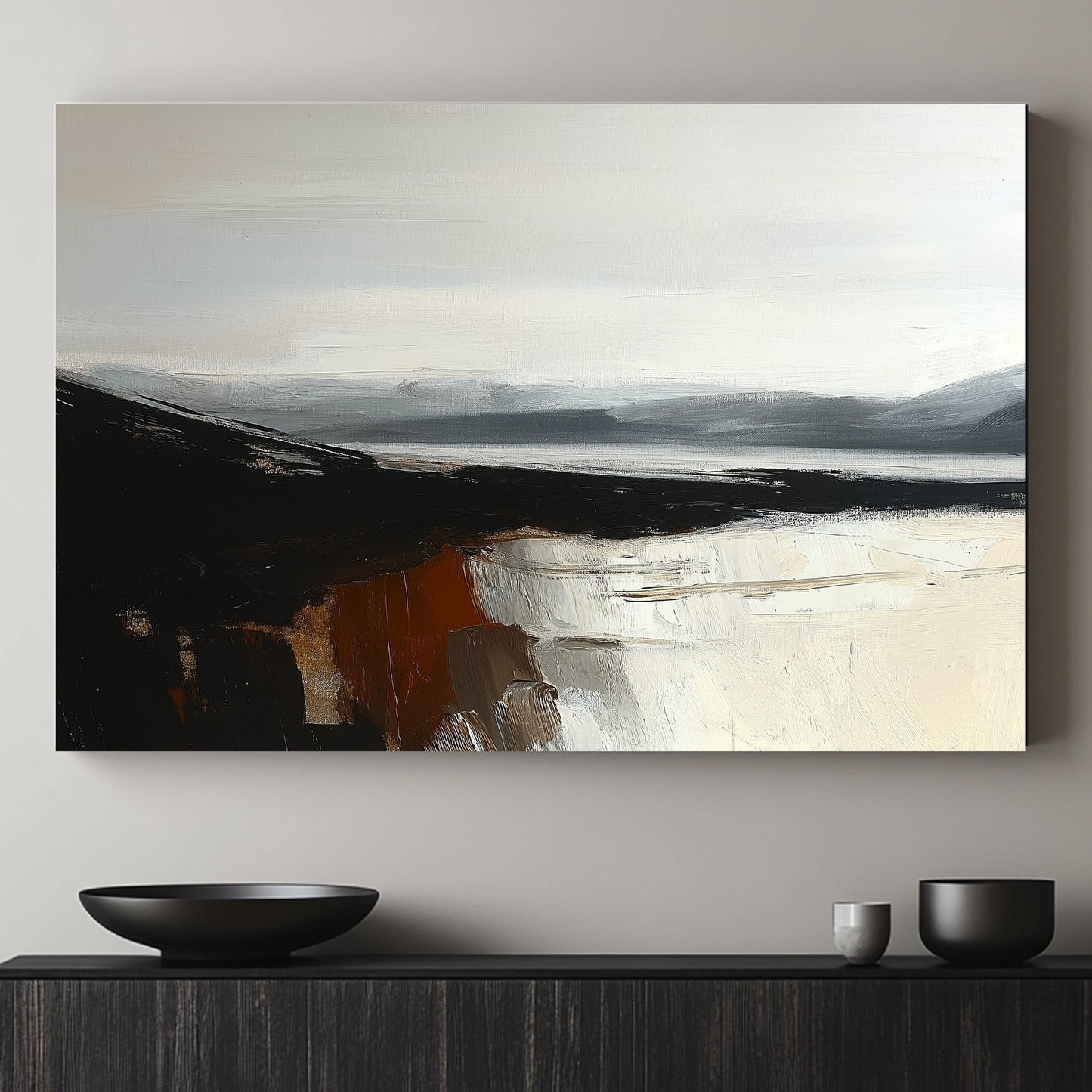 Minimalist landscape with black cliffs, grey mountains, and cream reflections on calm water.