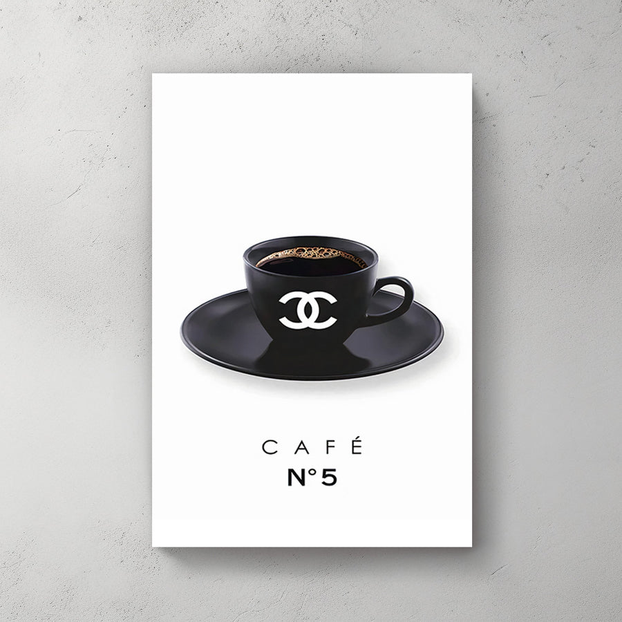 A minimalist art print of a branded black coffee cup with the Chanel logo, placed on a matching saucer, against a clean white background.
