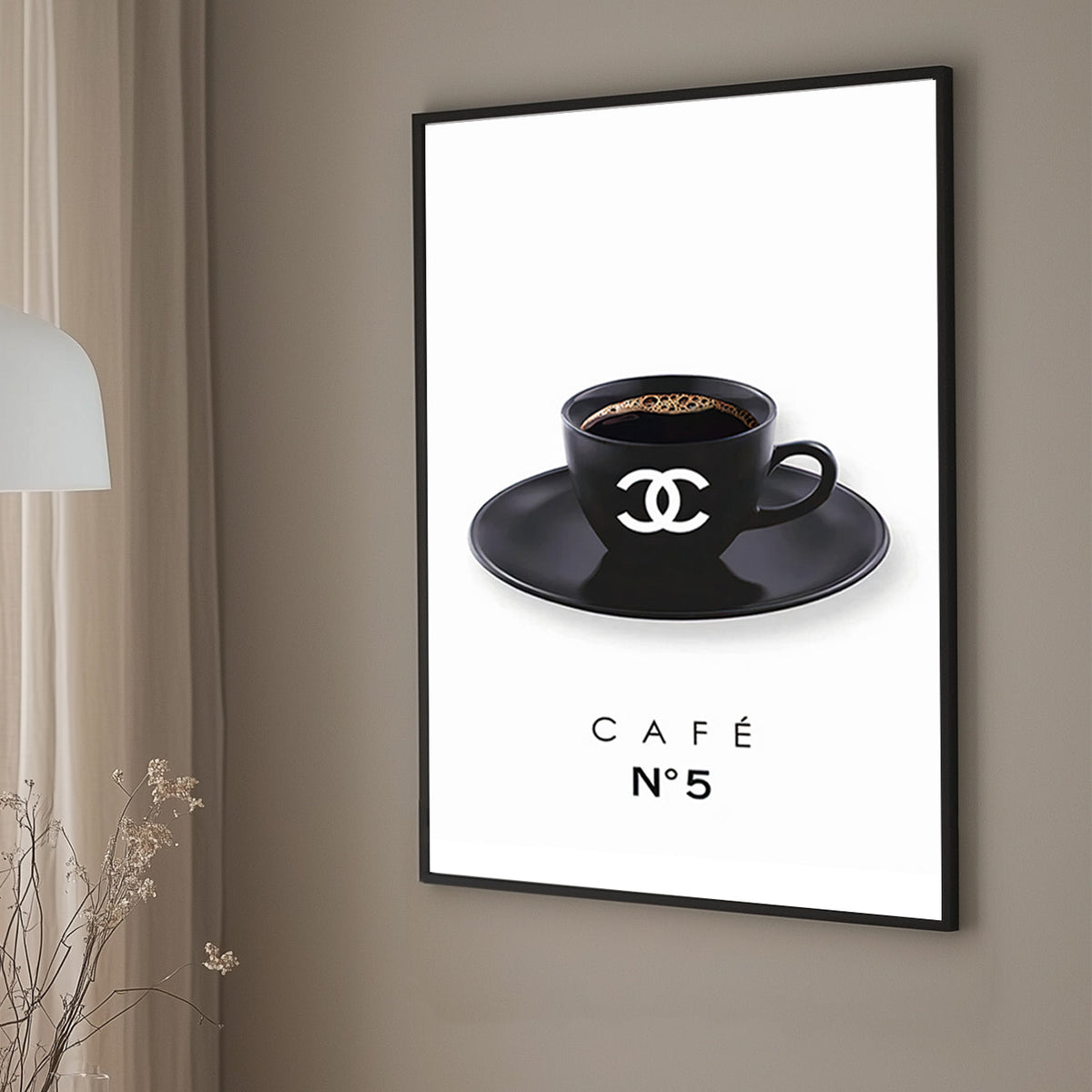 A minimalist art print of a branded black coffee cup with the Chanel logo, placed on a matching saucer, against a clean white background.