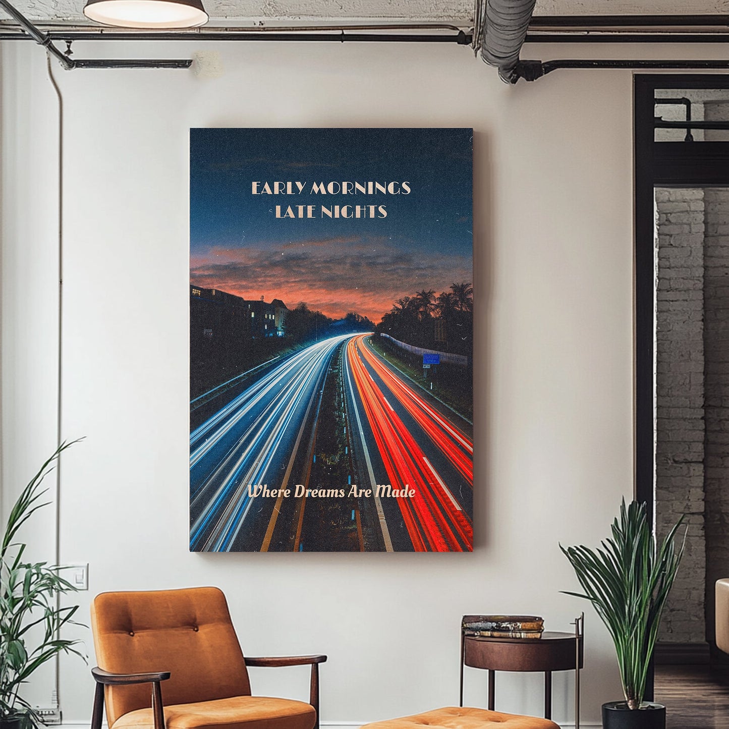 A motivational wall art print of a highway at dawn with streaking headlights and taillights, set against a vibrant sky transitioning from night to day, symbolizing hustle and determination.