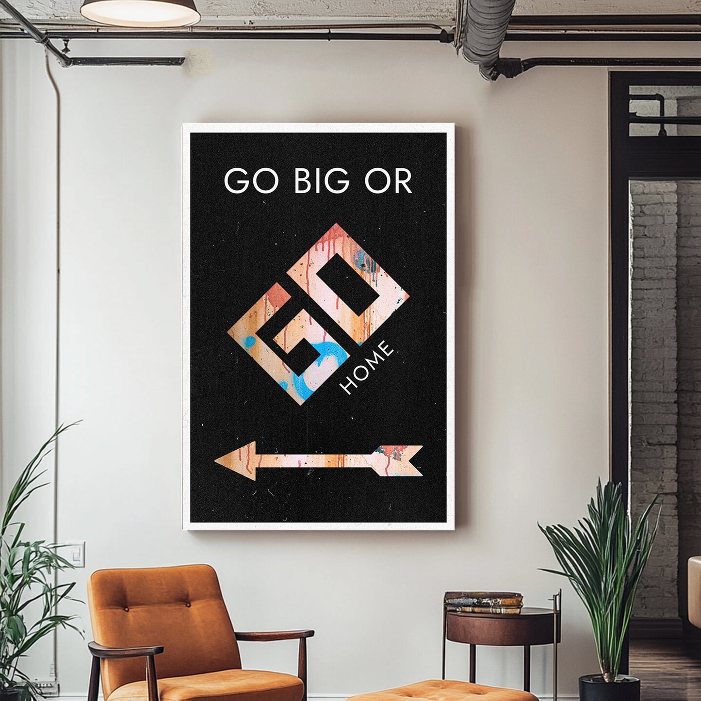 A bold motivational art piece with graffiti-inspired text "Go Big or Go Home" on a black background, featuring a colourful arrow and geometric design.