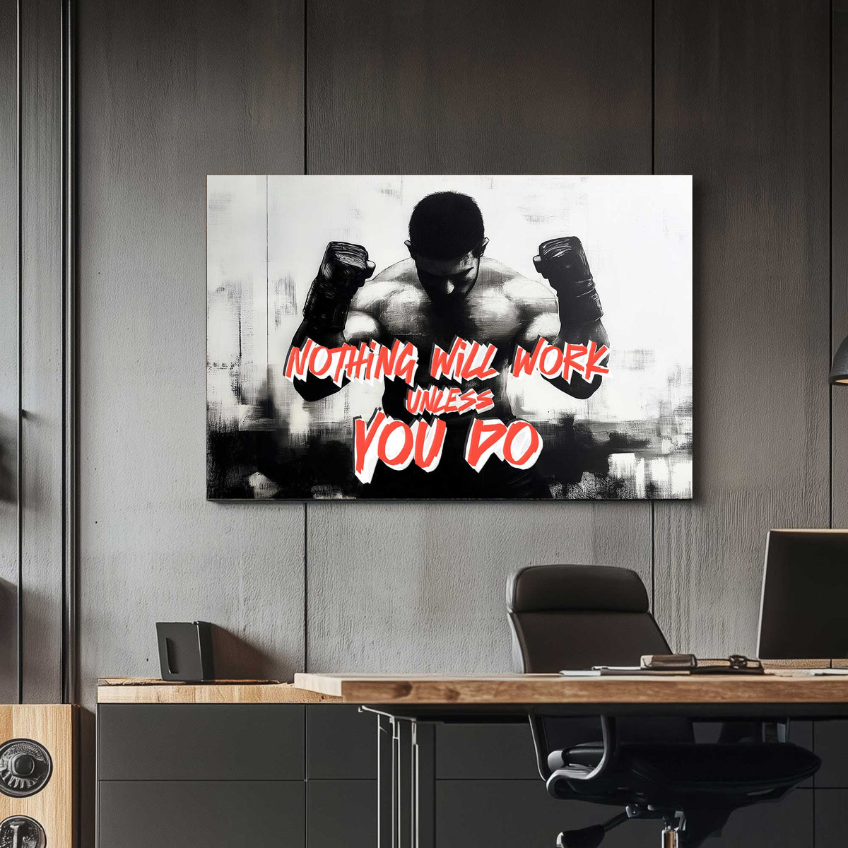 A black-and-white wall art print of a muscular boxer with clenched fists, accompanied by the motivational text "Nothing Will Work Unless You Do."