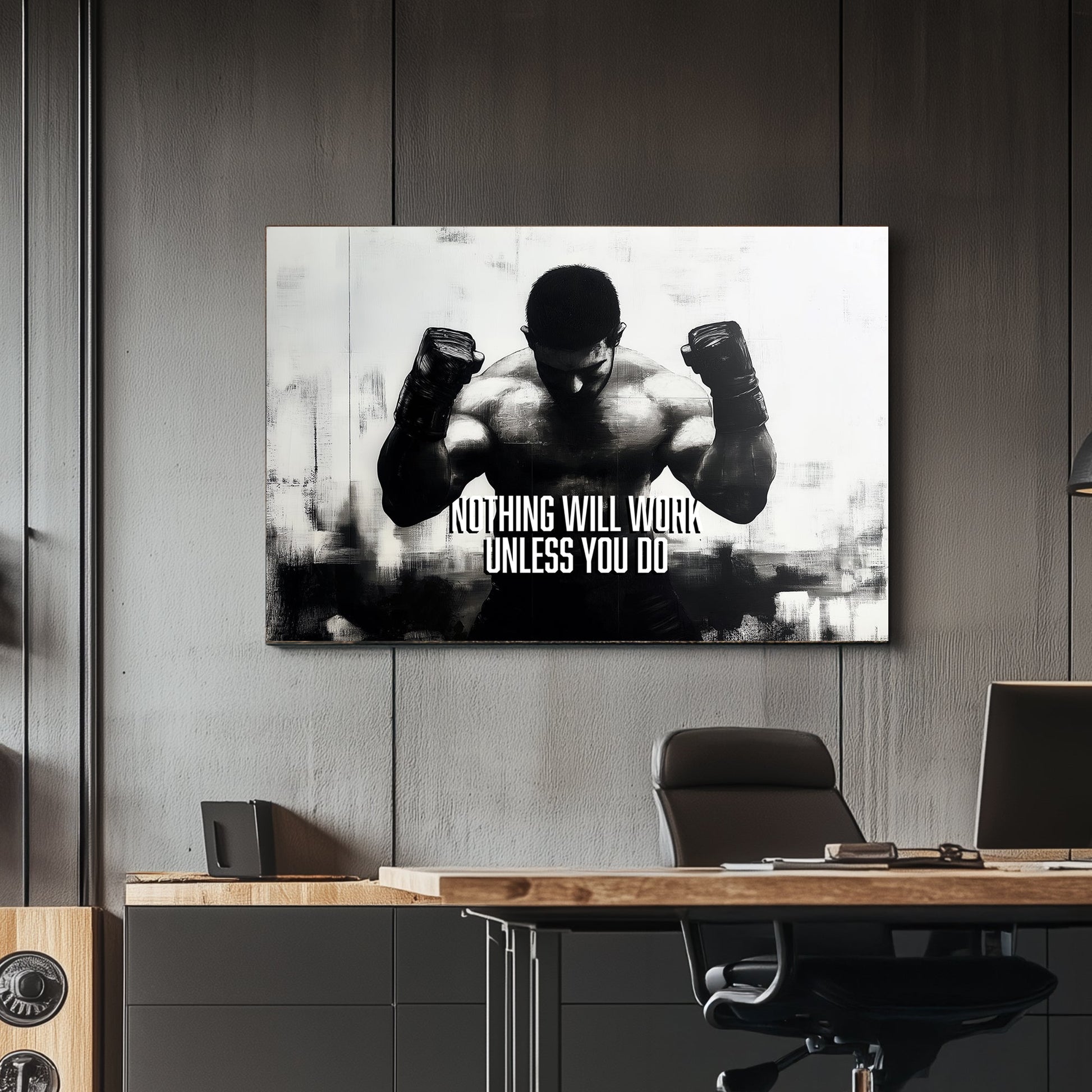 A black-and-white wall art print of a muscular boxer with clenched fists, accompanied by the motivational text "Nothing Will Work Unless You Do."